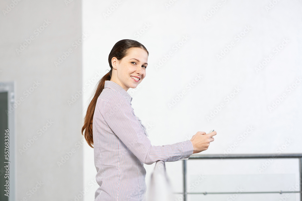 young attractive woman with phone in her hands