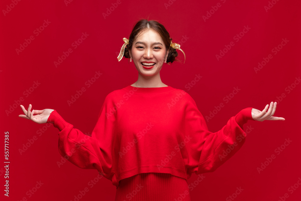 Young asian woman wearing red sweater dress with product presentation on red background for Chinese 