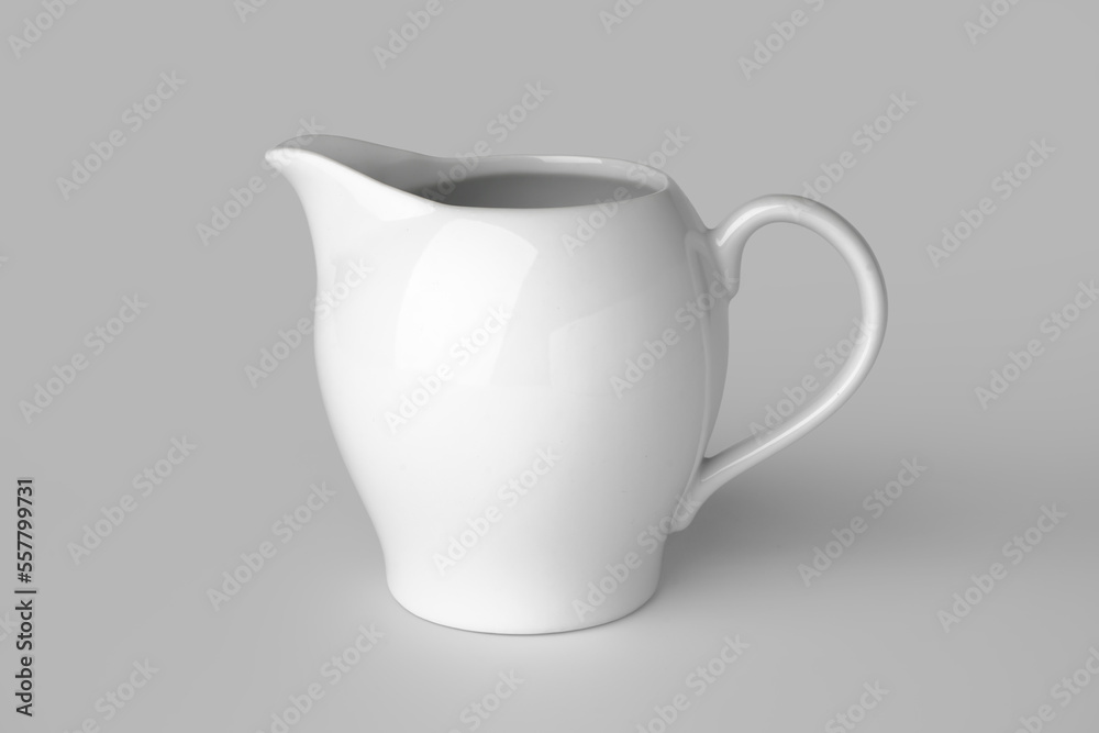 Empty pitcher on grey background