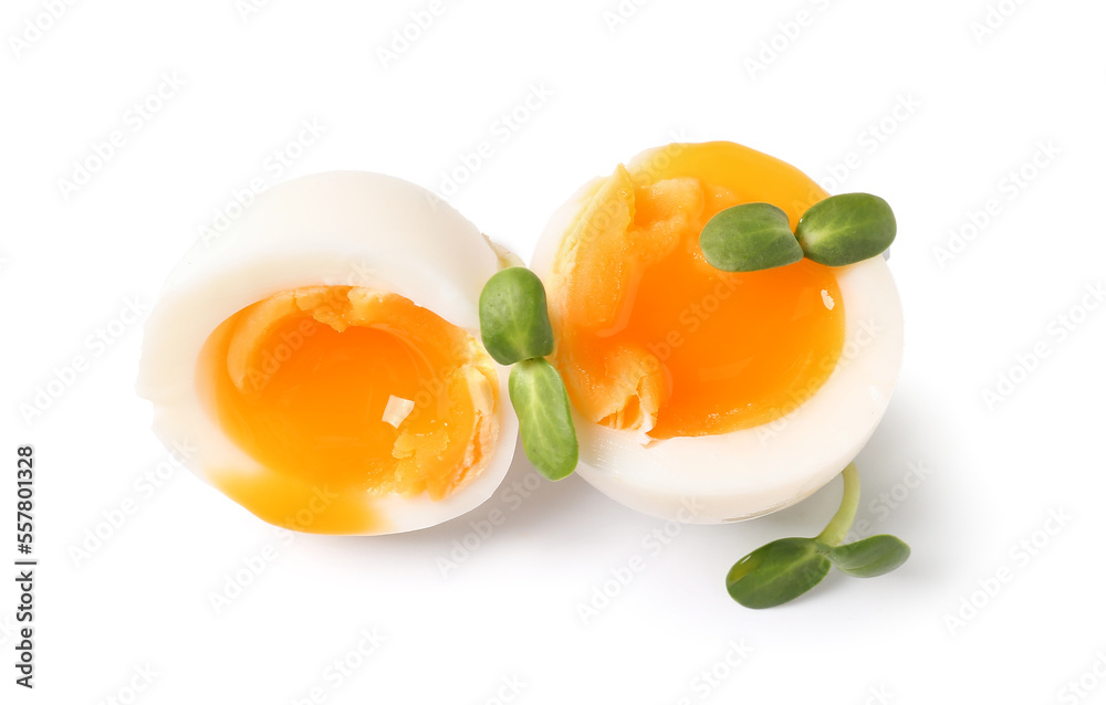 Soft boiled eggs with micro green on white background