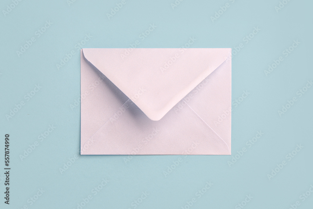 White paper envelope on color background