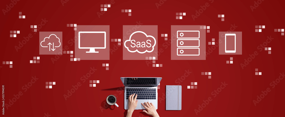 SaaS - software as a service concept with person working with a laptop