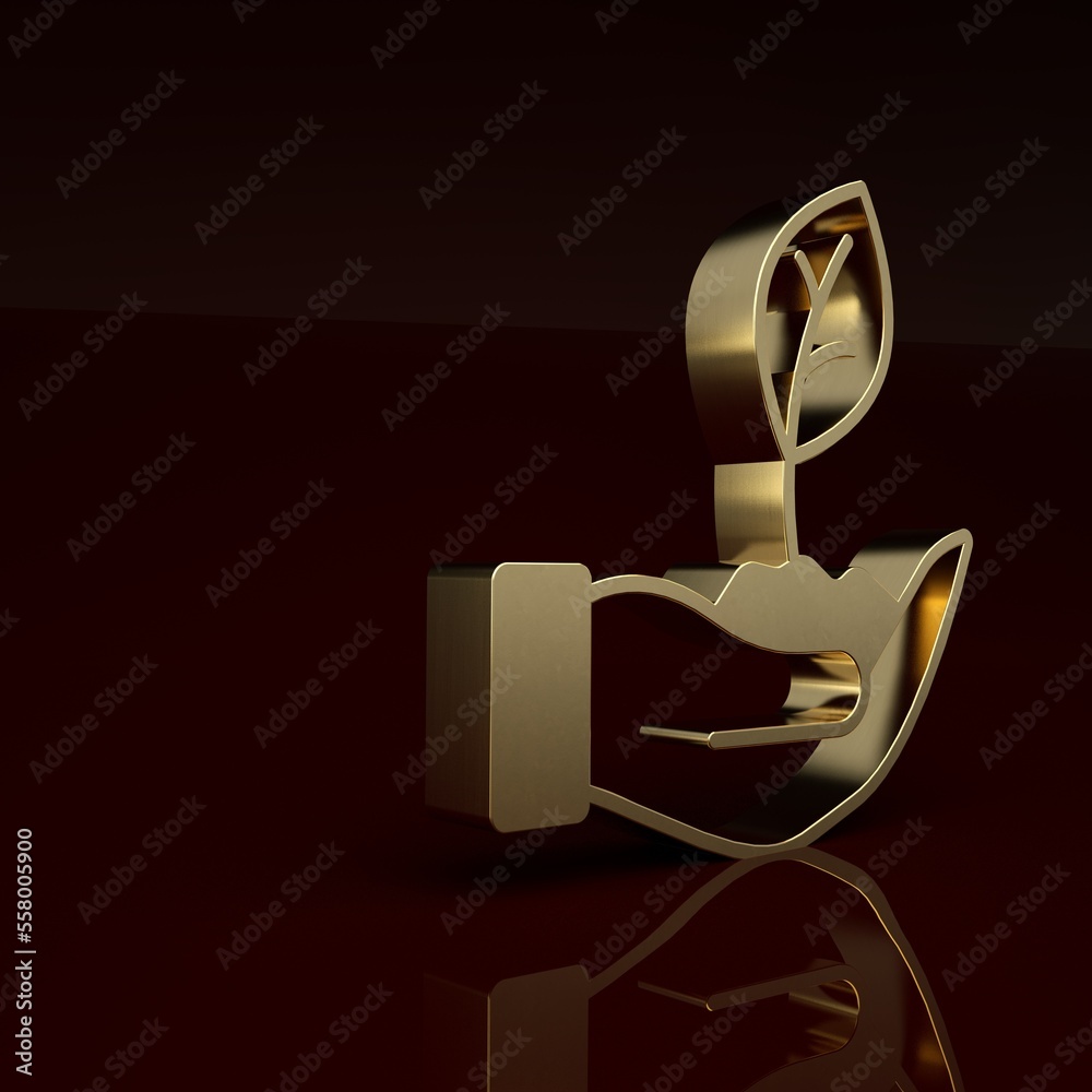 Gold Plant in hand of environmental protection icon isolated on brown background. Seed and seedling.