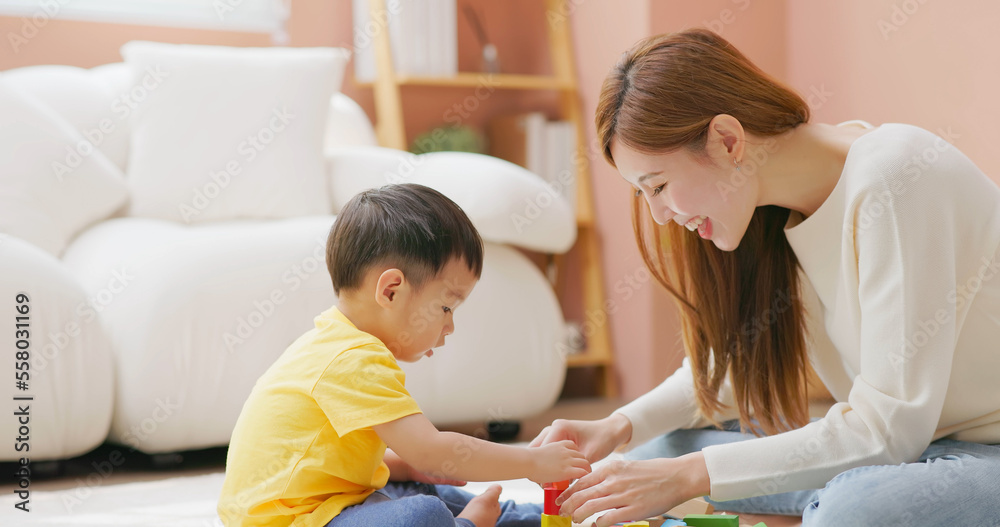 Family playing with building blocks