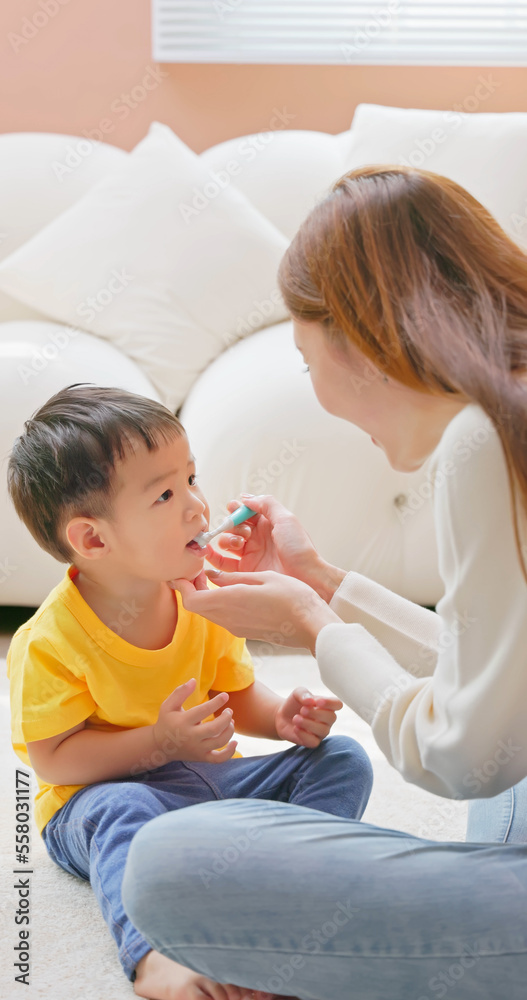 mom and son brush teeth