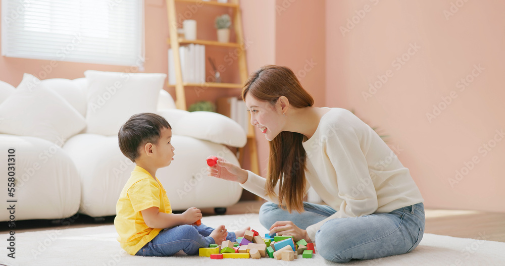 Family playing with building blocks