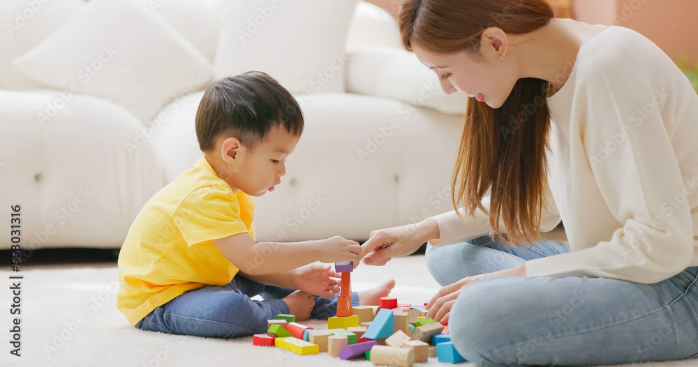 Family playing with building blocks