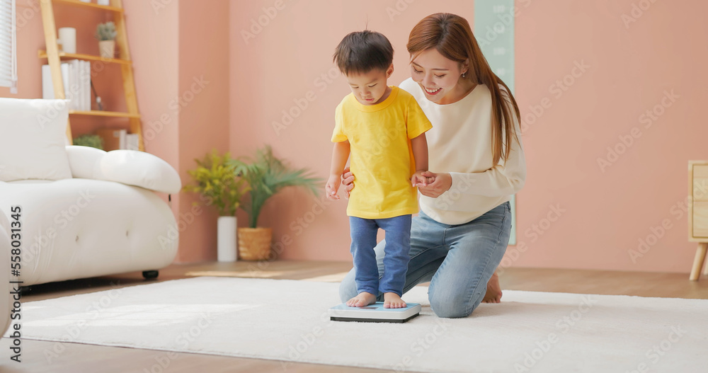 child standing on a scale