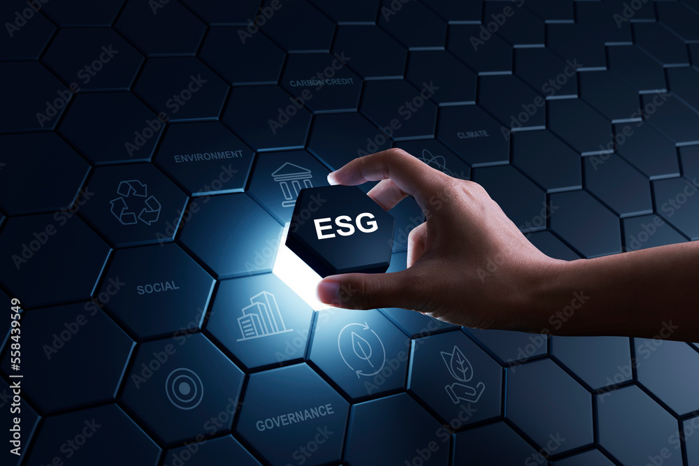 Hand of human putting hexagon peice to full fill the part of ESG