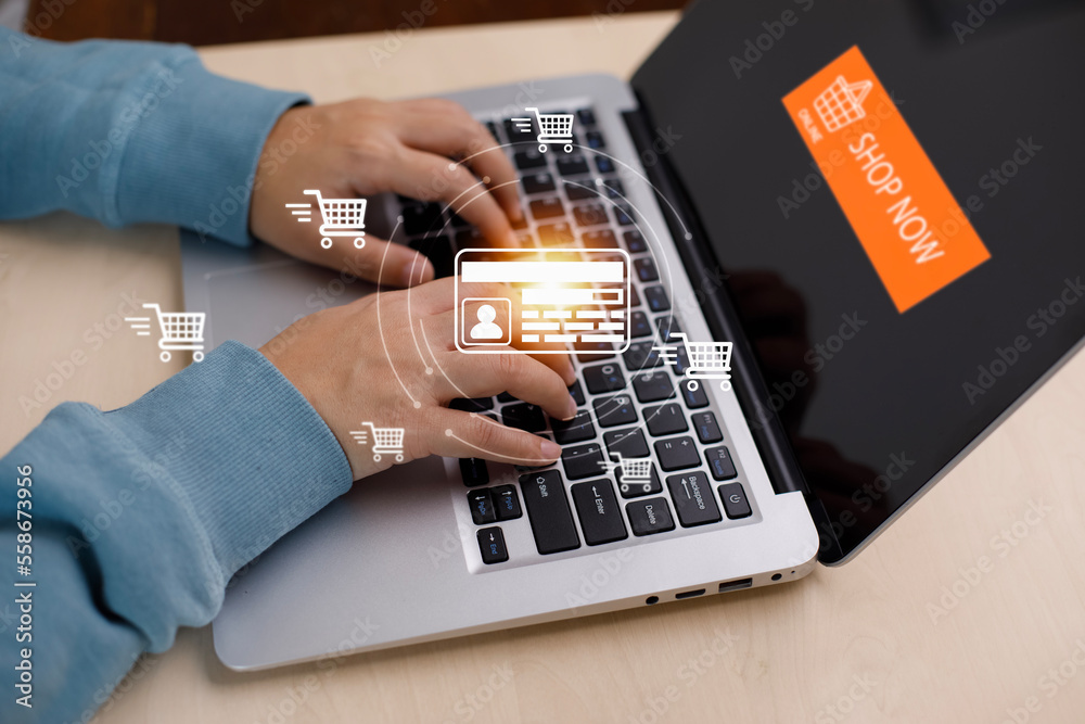 Businessman using a laptop with online shopping concept, marketplace website with virtual interface 