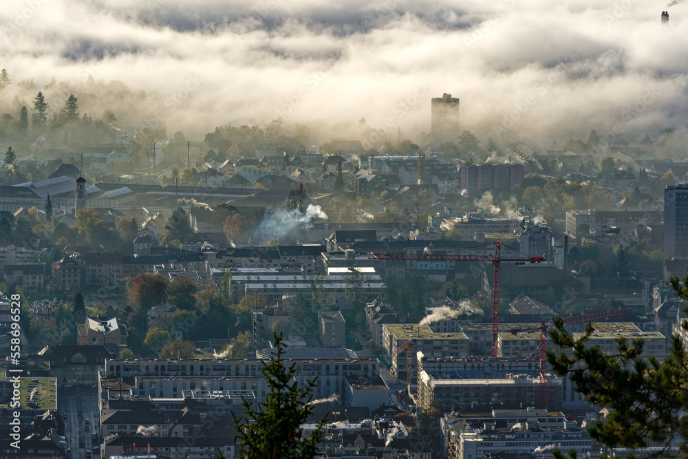 Aerial view over Swiss City of Biel Bienne, Canton Bern, seen from village Evilard on a sunny foggy 