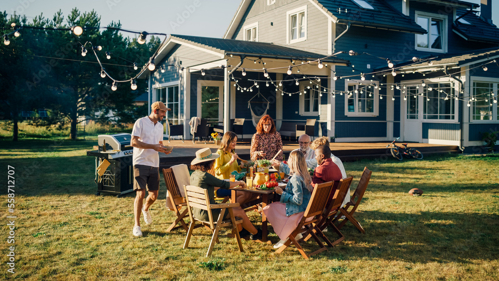 Group of Multiethnic Diverse People Having Fun, Communicating with Each Other and Eating at Outdoors