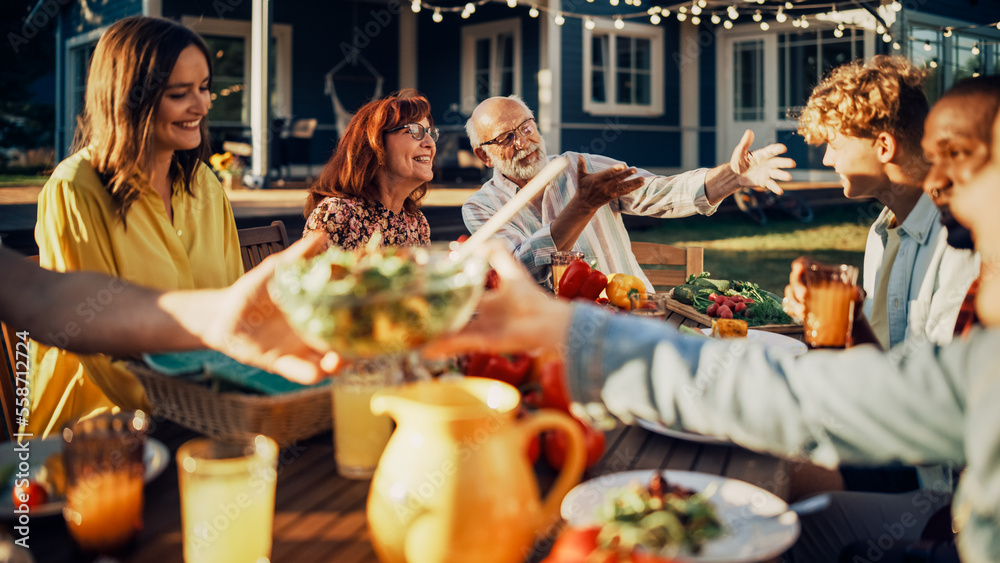 Grandfather Proud of His Grandson Achievements, Cheering Him Up at a Family Outdoors Dinner Table wi