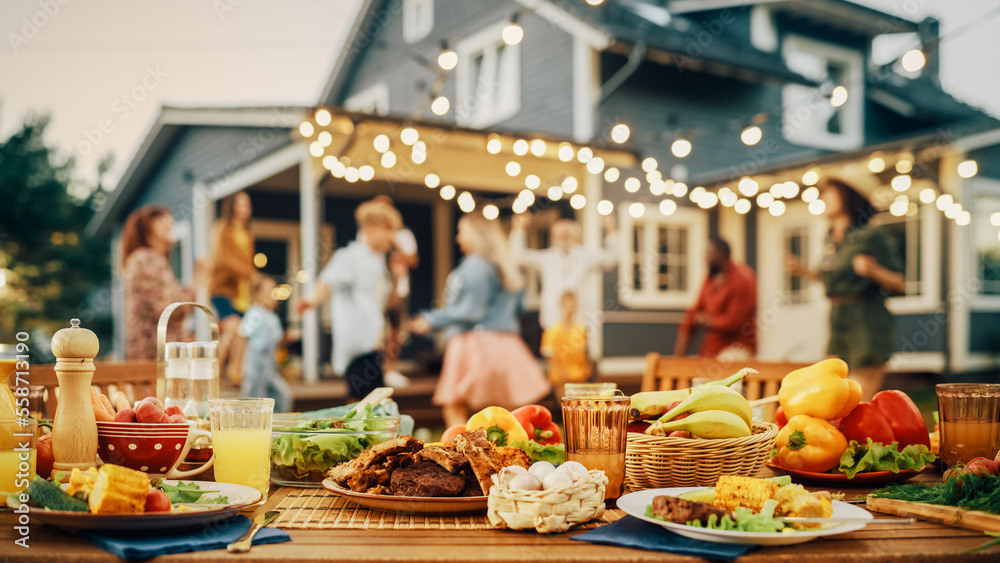 Outdoors Dinner Table with Gorgeous-Looking Barbecue Meat, Fresh Vegetables and Salads. Happy Joyful