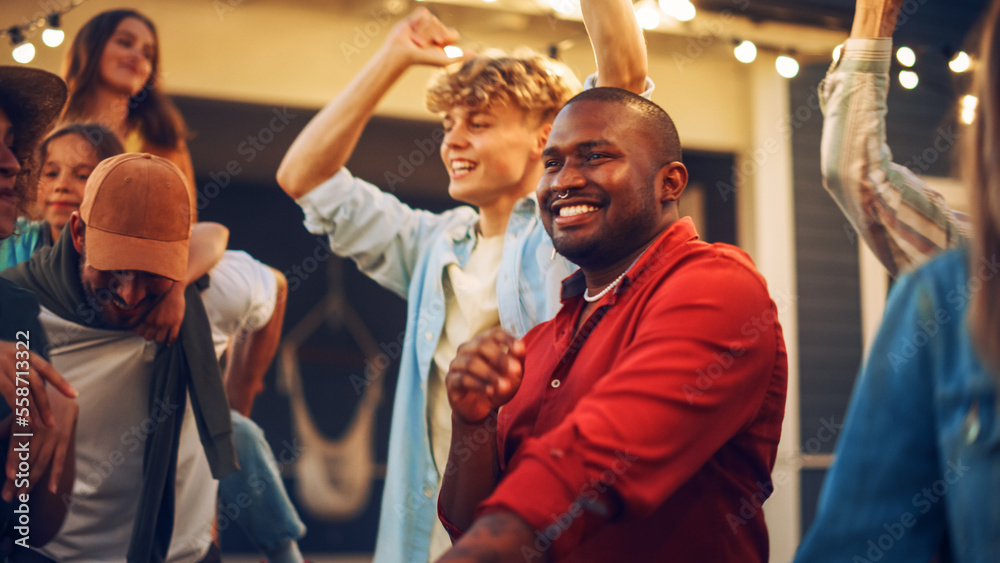 Group of Multicultural Diverse Friends and Relatives Having Fun and Dancing Together at a Garden Par