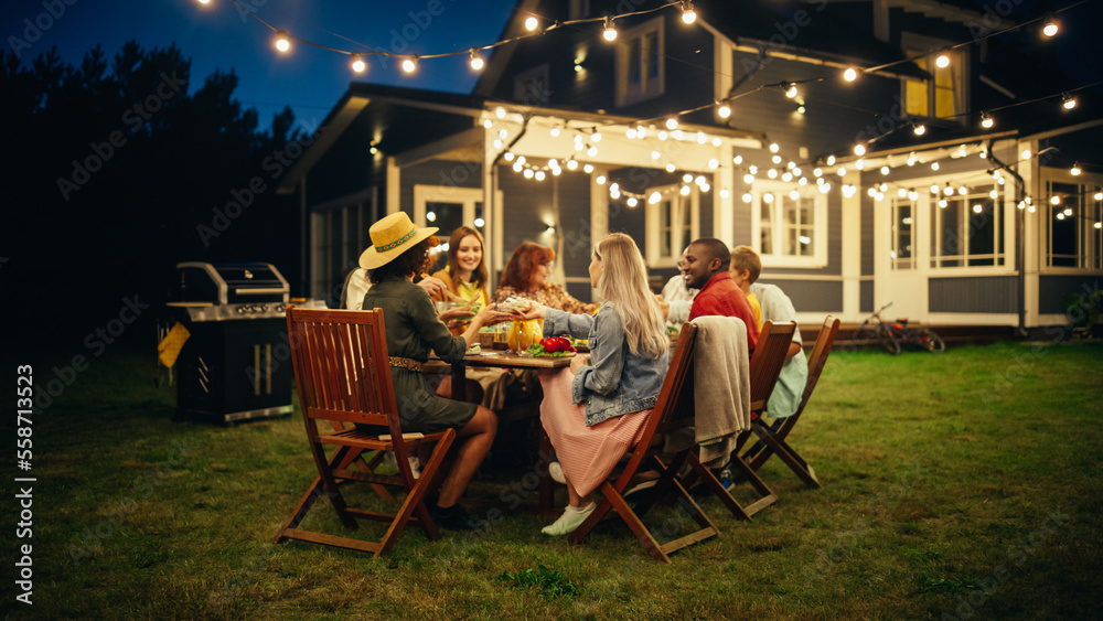 Family and Multicultural Friends Celebrating Outside at Home in the Evening. Group of Children, Adul