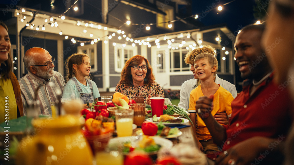 Senior Grandparent Sharing Interesting Childhood Memories to Her Diverse Relatives and Multiethnic F