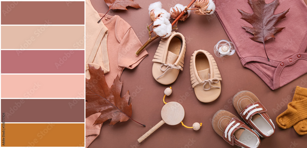 Autumn composition with baby clothes, shoes and accessories on brown background. Different color pat