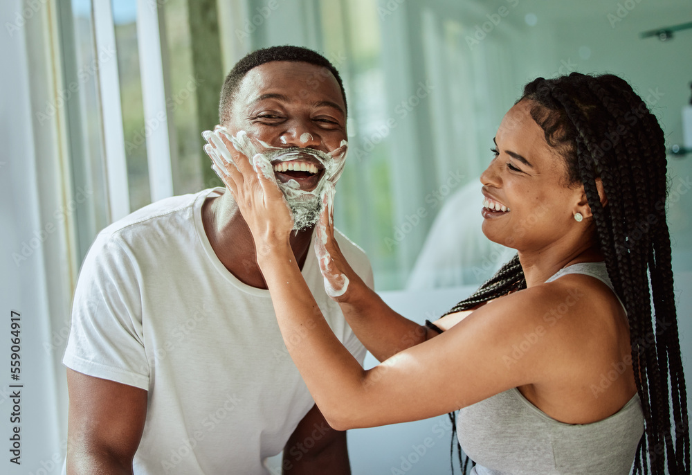 Shaving, playful and fun with a black couple laughing or joking together in the bathroom of their ho