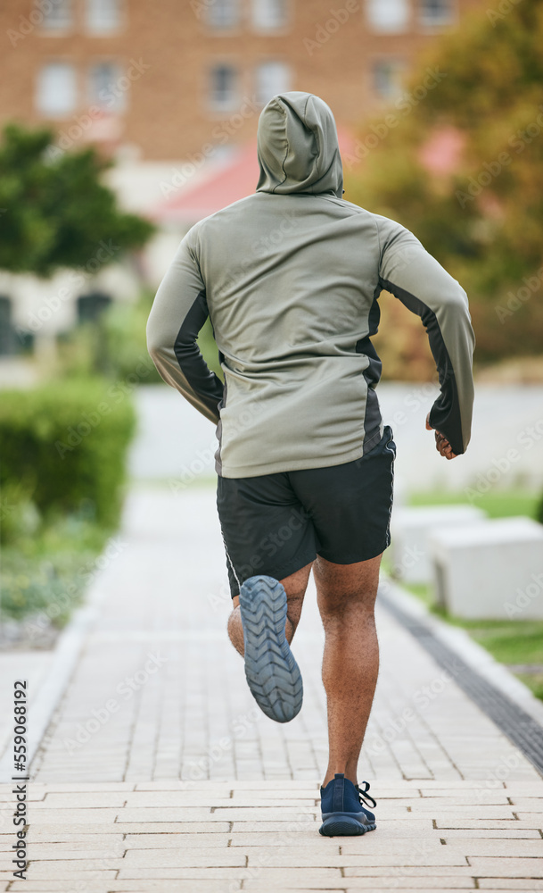 Fitness, back and black man running in city in winter for health, wellness and strength. Sports, exe