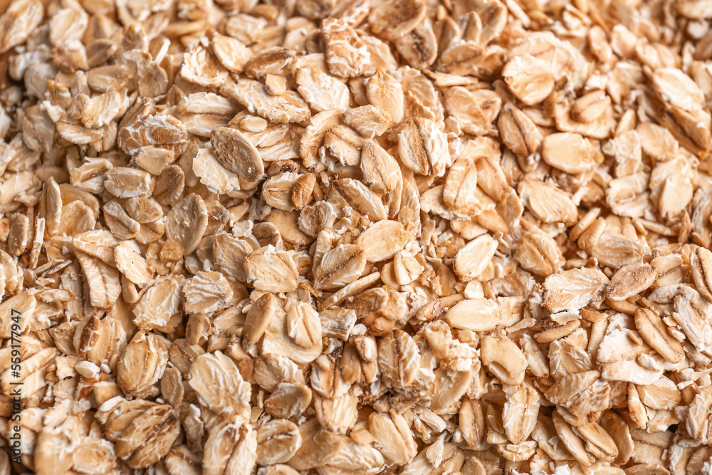 Raw oat flakes as background, closeup