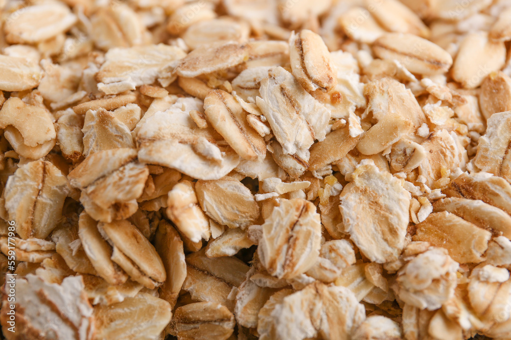 Raw oat flakes as background, closeup