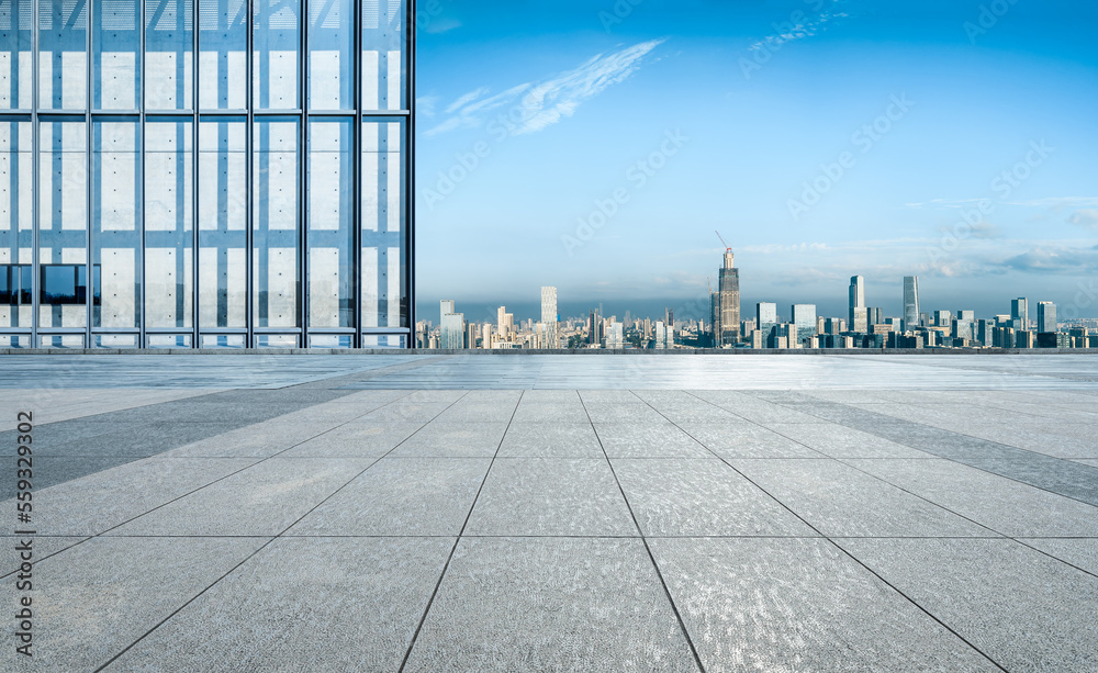 Empty square floor and city skyline with modern buildings in Ningbo, Zhejiang Province, China.