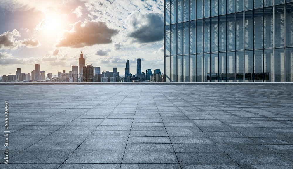 Empty square floor and modern city skyline with buildings at sunset in Ningbo, Zhejiang Province, Ch