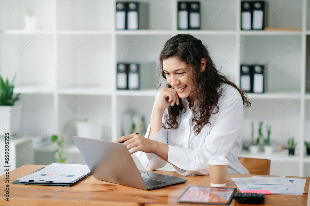 businesswoman working in the office with working notepad, tablet and laptop documents .