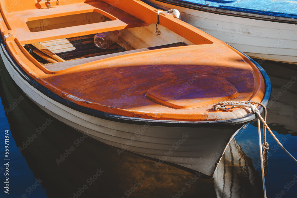 Fishing boats moored in small marina in town of Lovran, Croatia