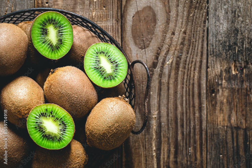 Kiwi fruits on a wooden background, a view of the top.