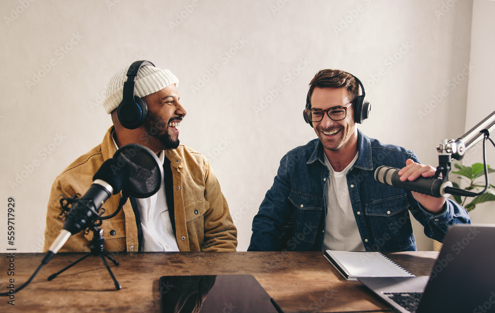 College radio djs having a good time in a studio