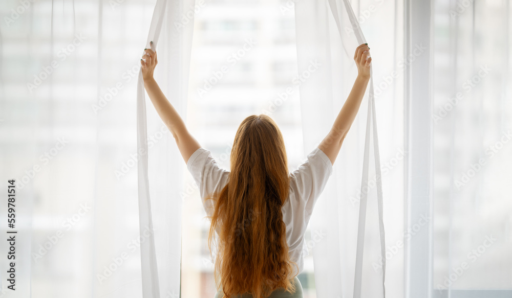 Woman opening the window