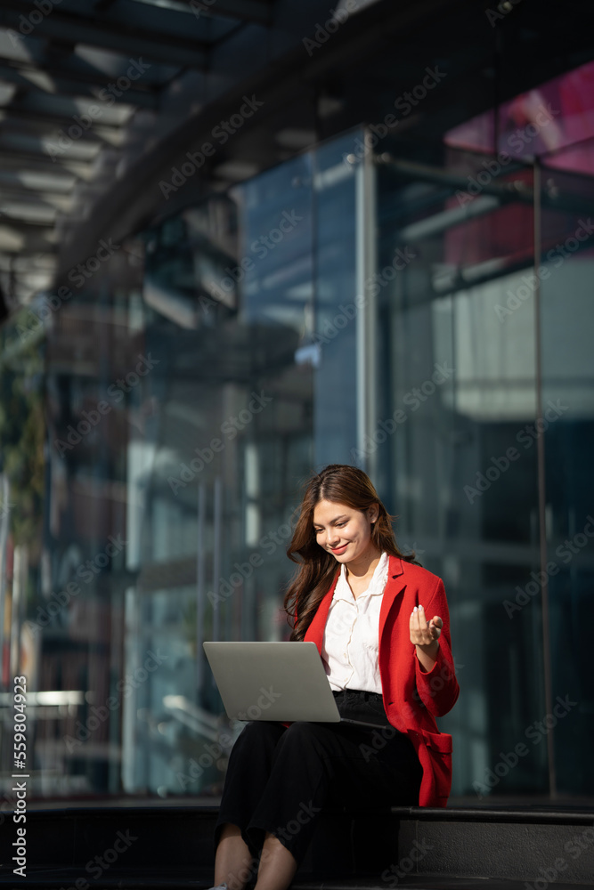 Asian business woman with computer laptop pc in office district.