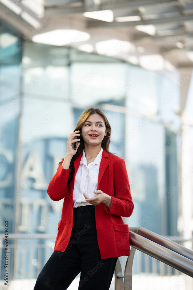 Young asian businesswoman using smart phone in office..