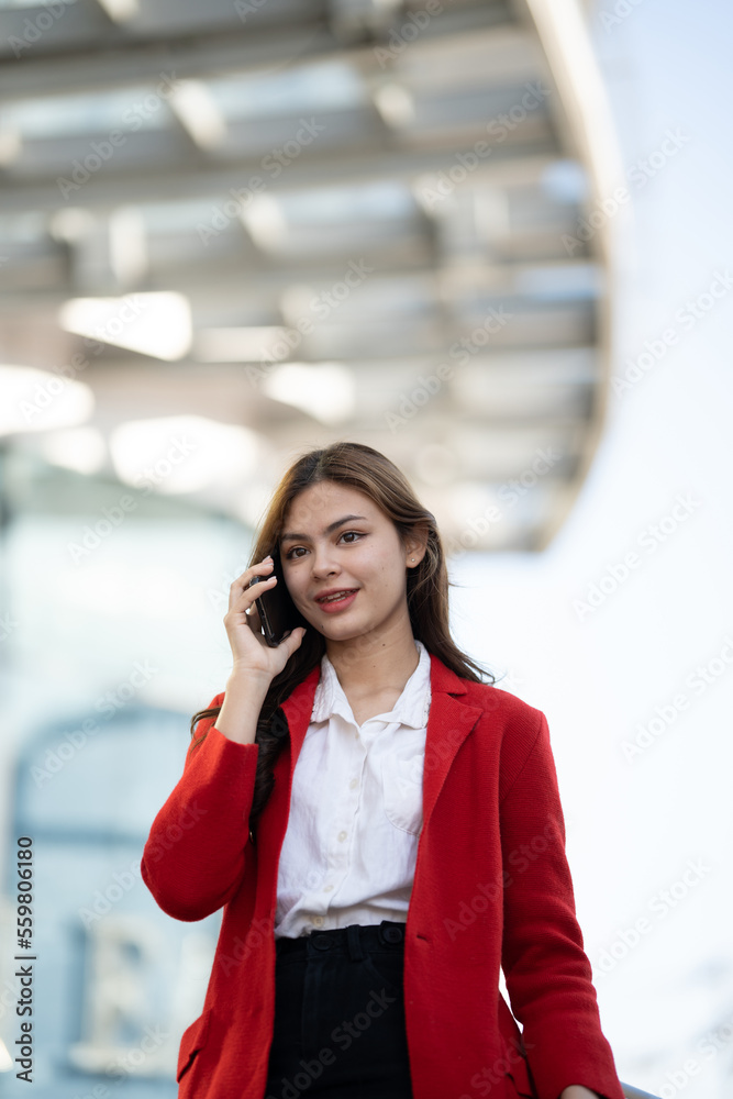 Young asian businesswoman using smart phone in office..