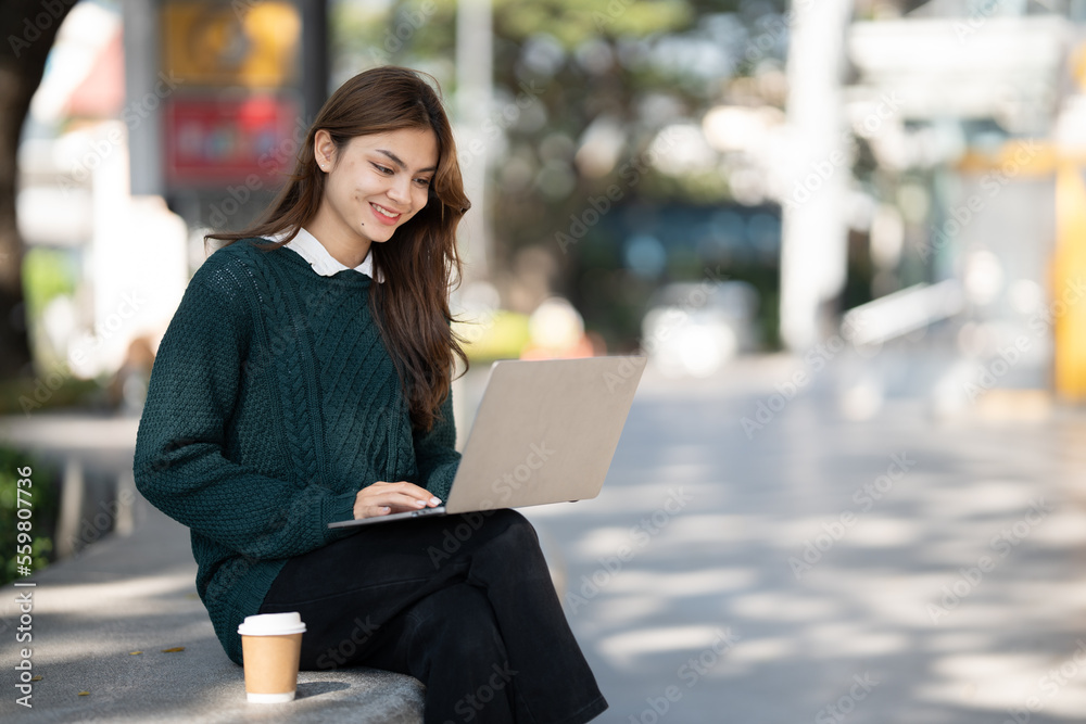 Asian woman student with tablet pc at school.