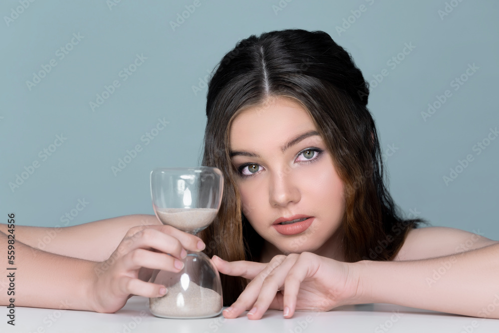 Concept of skincare and anti-aging beauty care with charming young plum girl closeup portrait holdin