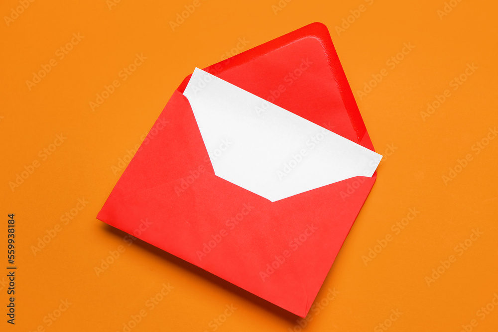 Red paper envelope with card on color background