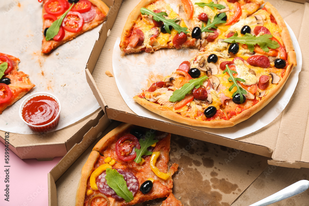 Cardboard boxes with tasty pizza, closeup