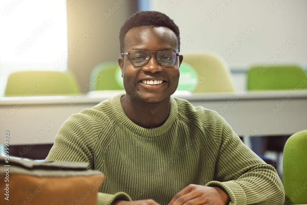 Black man, student and portrait in classroom for education, study and happy at college with smile. A