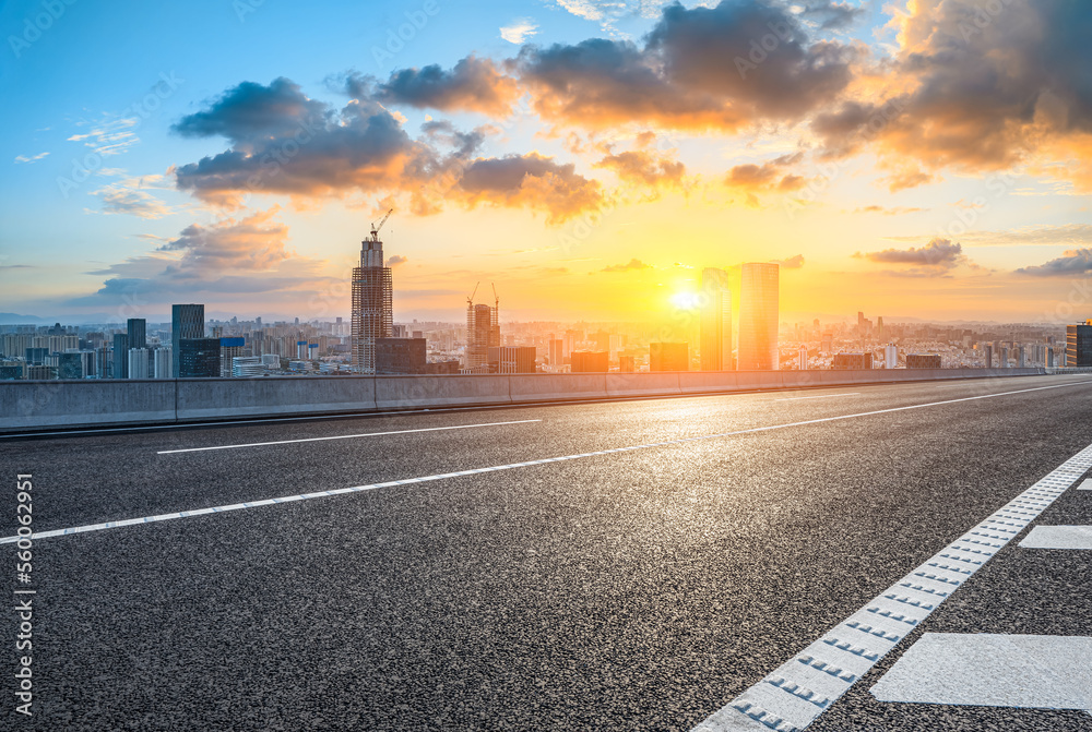 Asphalt road and modern city skyline with buildings in Ningbo, Zhejiang Province, China.