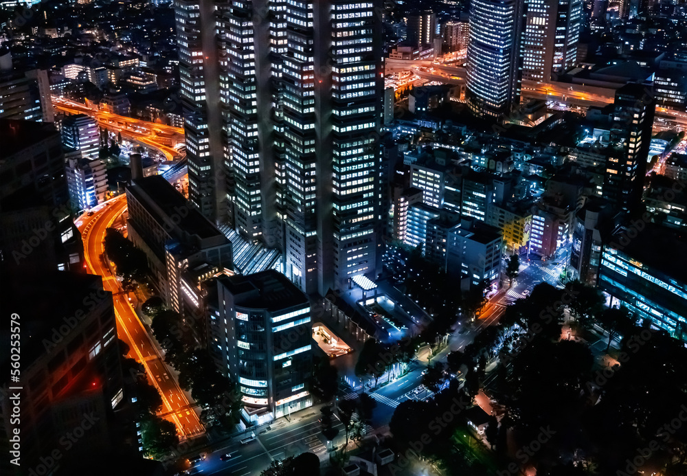 Skyscrapers towering above the night cityscape of Nishi-Shinjuku, Tokyo, Japan