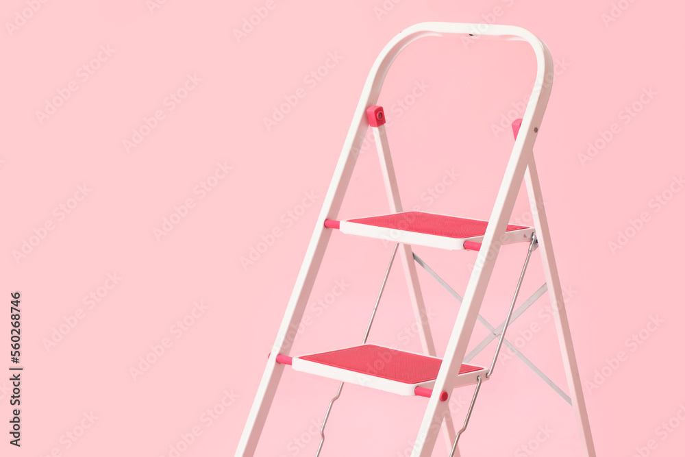 Maintenance ladder on pink background