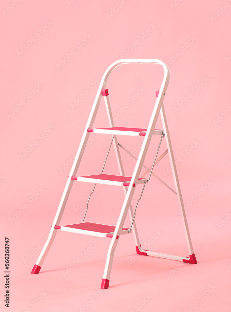 Maintenance ladder on pink background