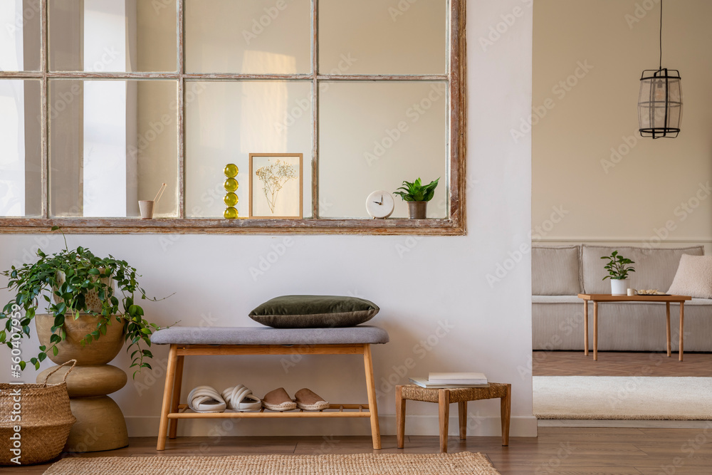 Minimalist composition of open space interior with mock up poster, bench, green pillow, plants, wood