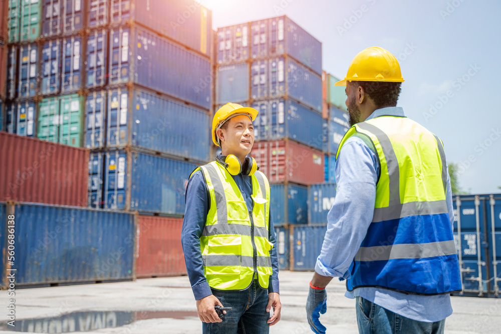 Engineer with foreman checking the container to prepare the delivery to the customer.