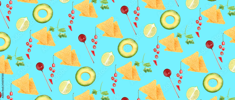 Tasty nachos with limes, avocados, chili peppers, cilantro and salsa sauce on blue background