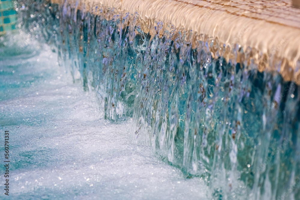 Fountain with running water in city, closeup