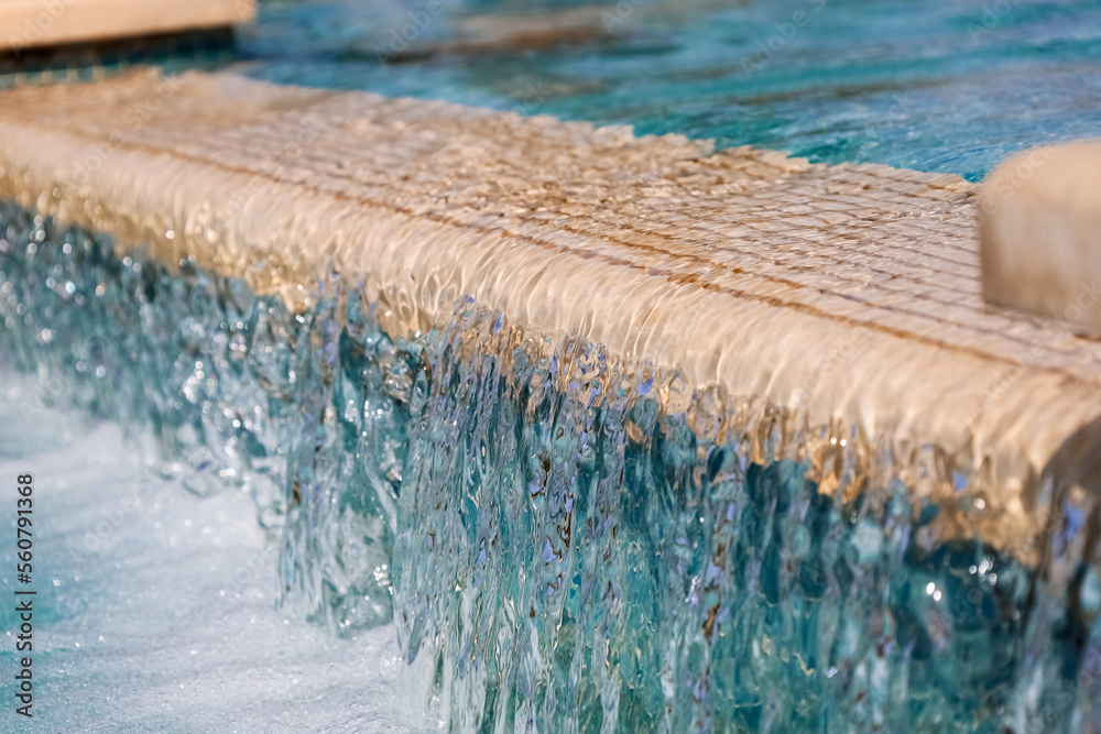 Fountain with running water in city, closeup